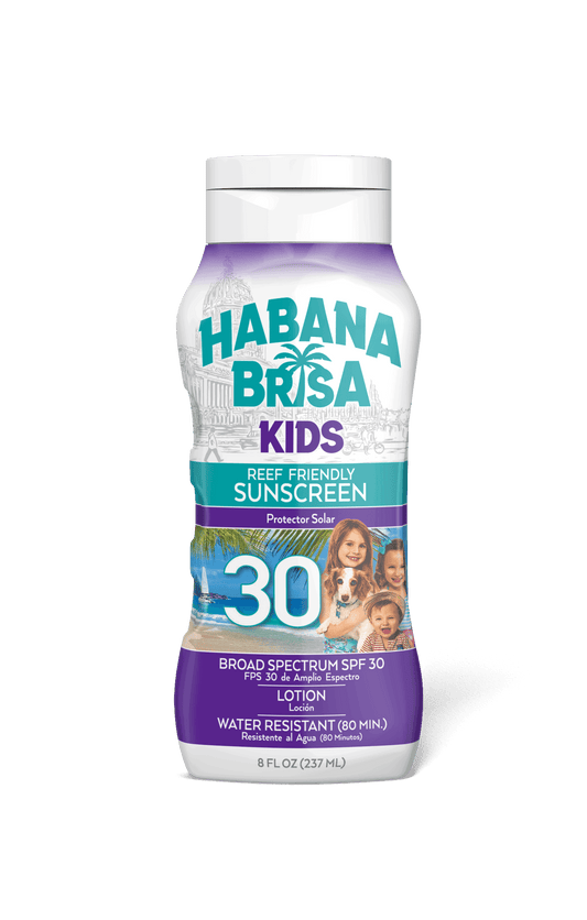 Habana Brisa Kids SPF 30 reef friendly sunscreen bottle with tropical beach and smiling children